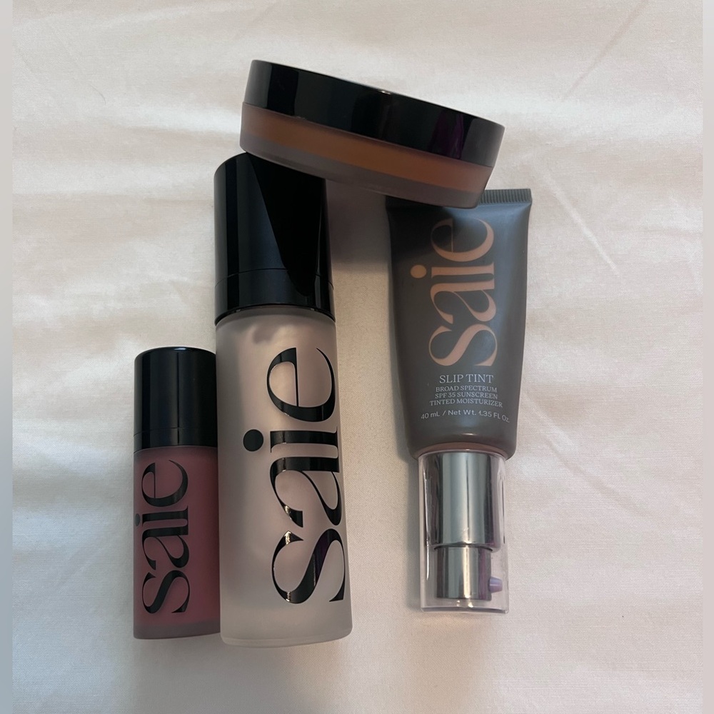 Saie makeup bundle. Moisturizer, bronzer, highlight, and blush